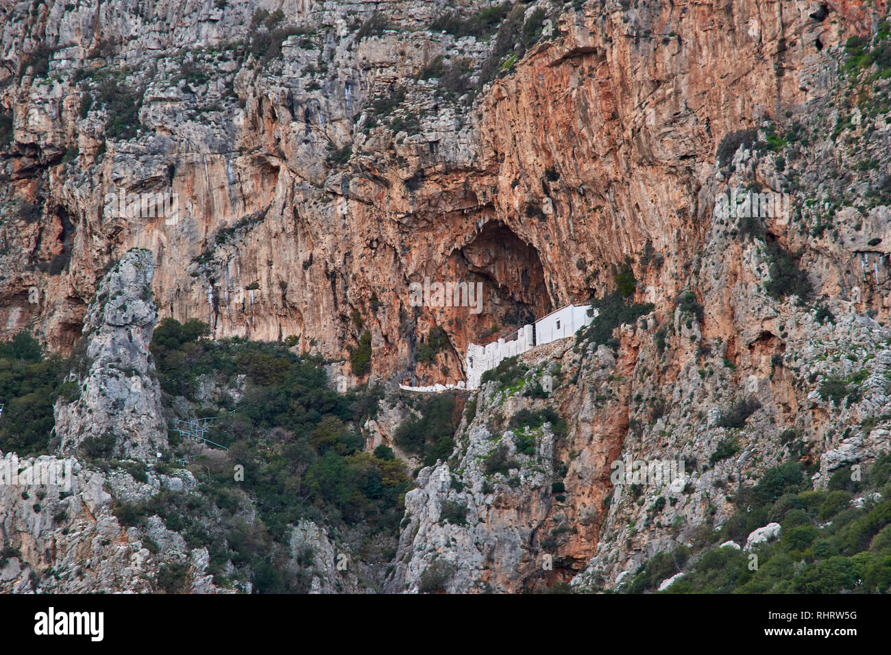 Tele photo view of the Holy Monastery of Zoodochos Pighi. Located over the Historical Byzantine village Velanidia near cape Malea, Greece. Stock Photo