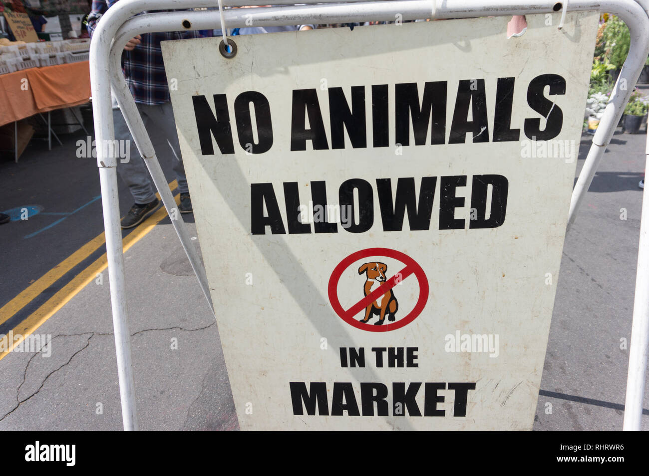 Close up of a sign which says 'No Animals Allowed in the Market' with a picture of a dog. This is in the Farmer's Market in Montrose, near Los Angeles Stock Photo