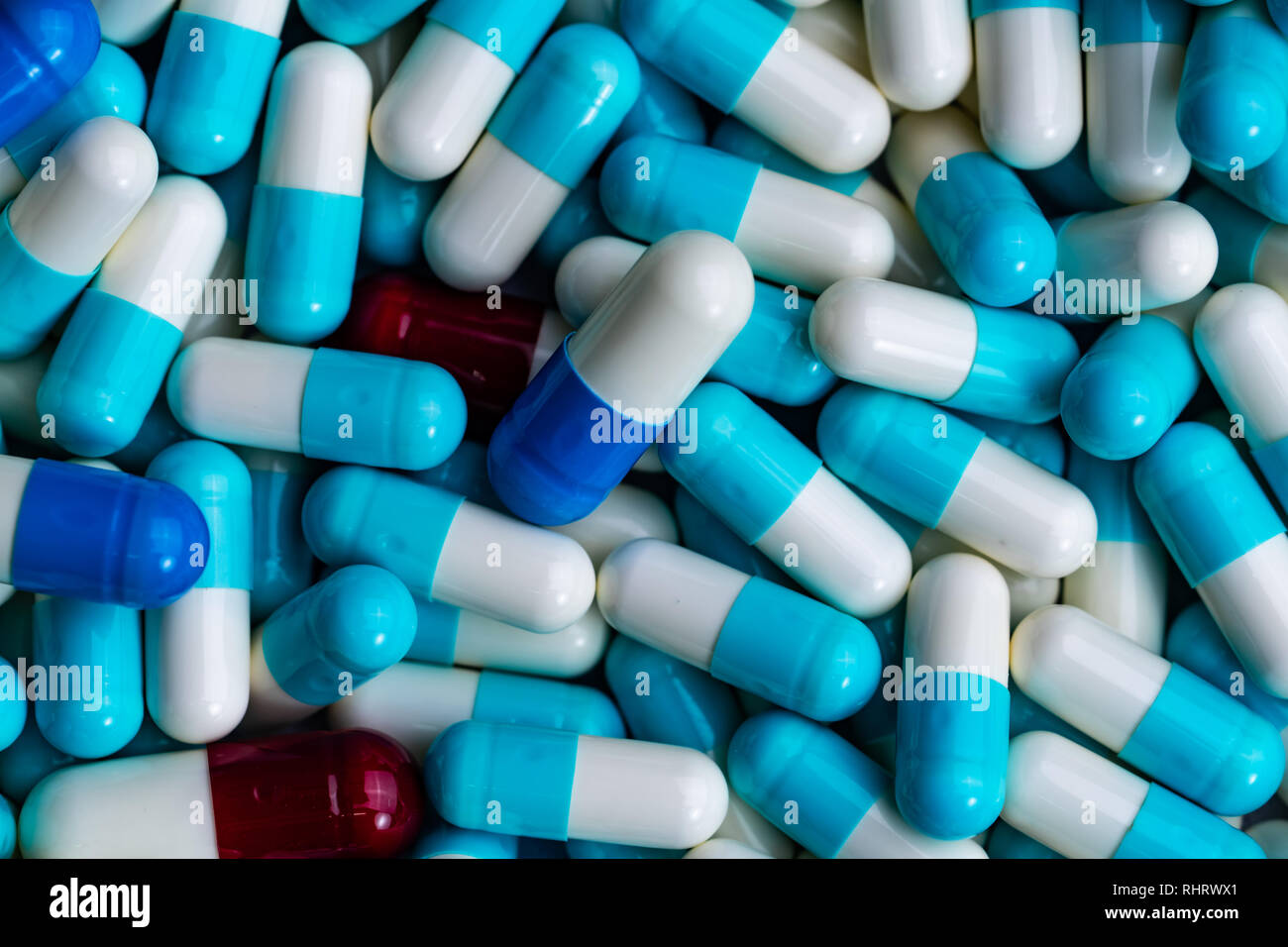 Pile of antibiotic capsule pills. Antibiotics drug resistance. Drug use