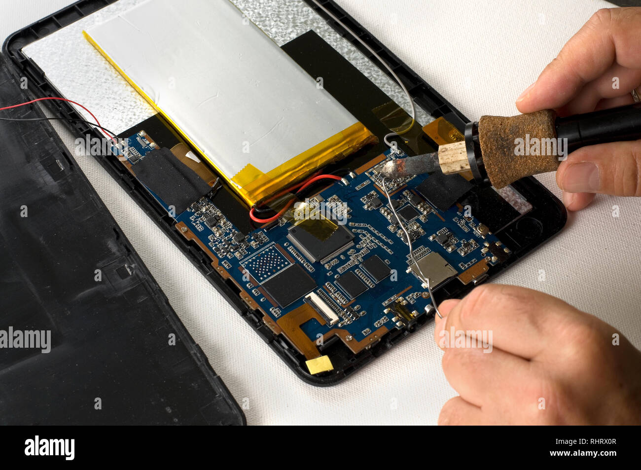 Repairman Soldering Electronic Device on White Background Stock Photo Alamy