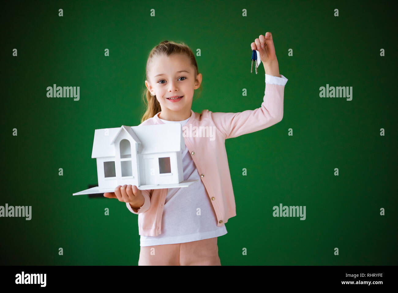 Hands holding model house hi-res stock photography and images - Alamy