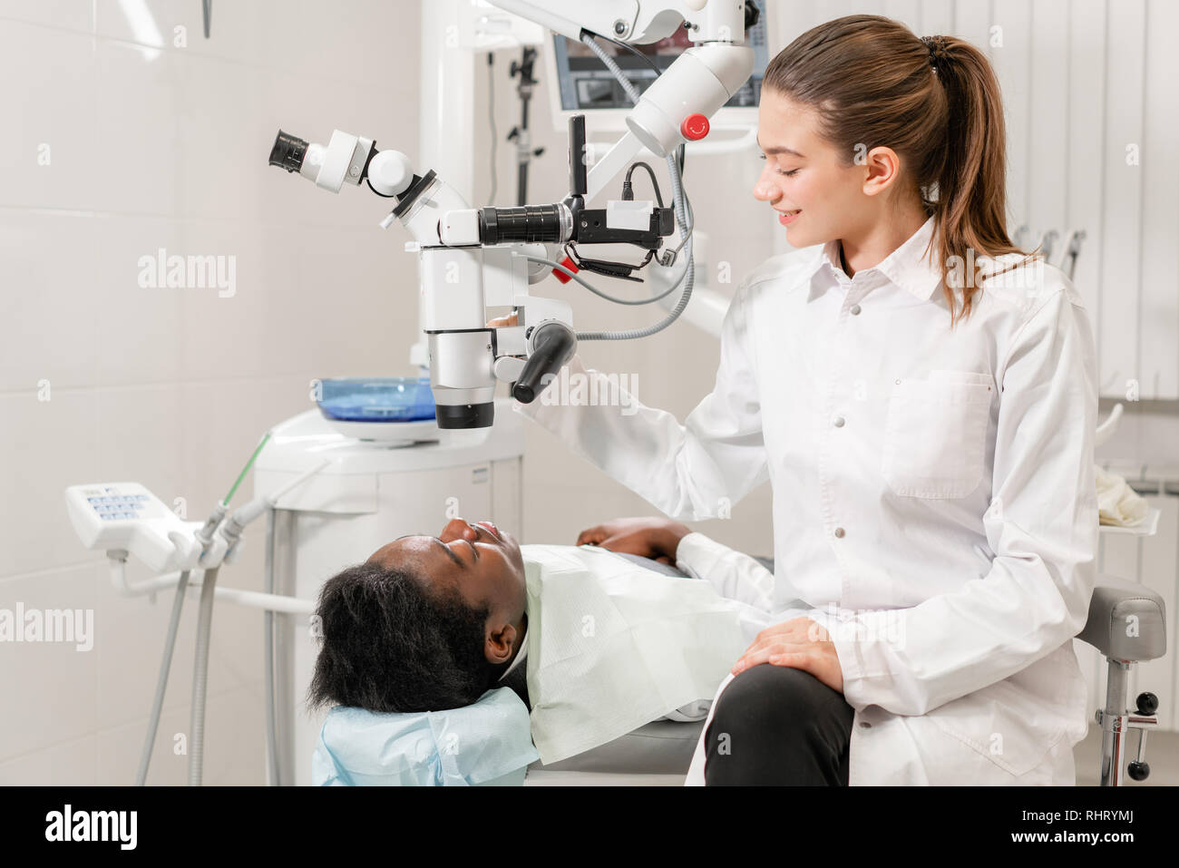 Female dentist advanced user, dental tools. Looking into the lens of a