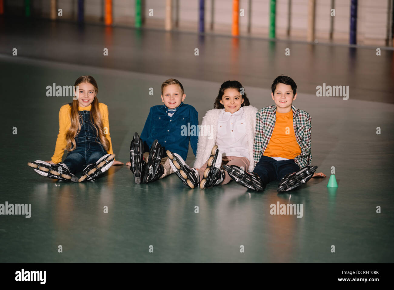 Group of kids in roller skates smiling at camera Stock Photo