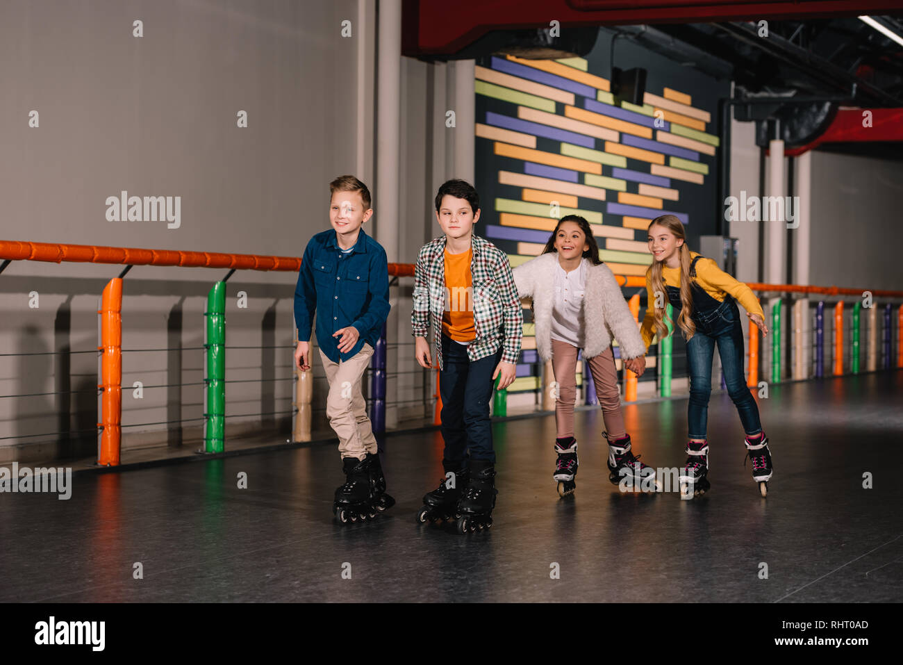 Group of friends in roller skates training together Stock Photo