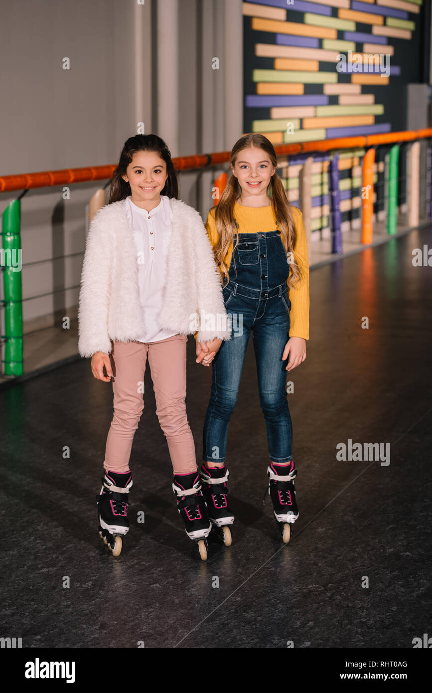 Full length shot of roller skaters holding hands Stock Photo