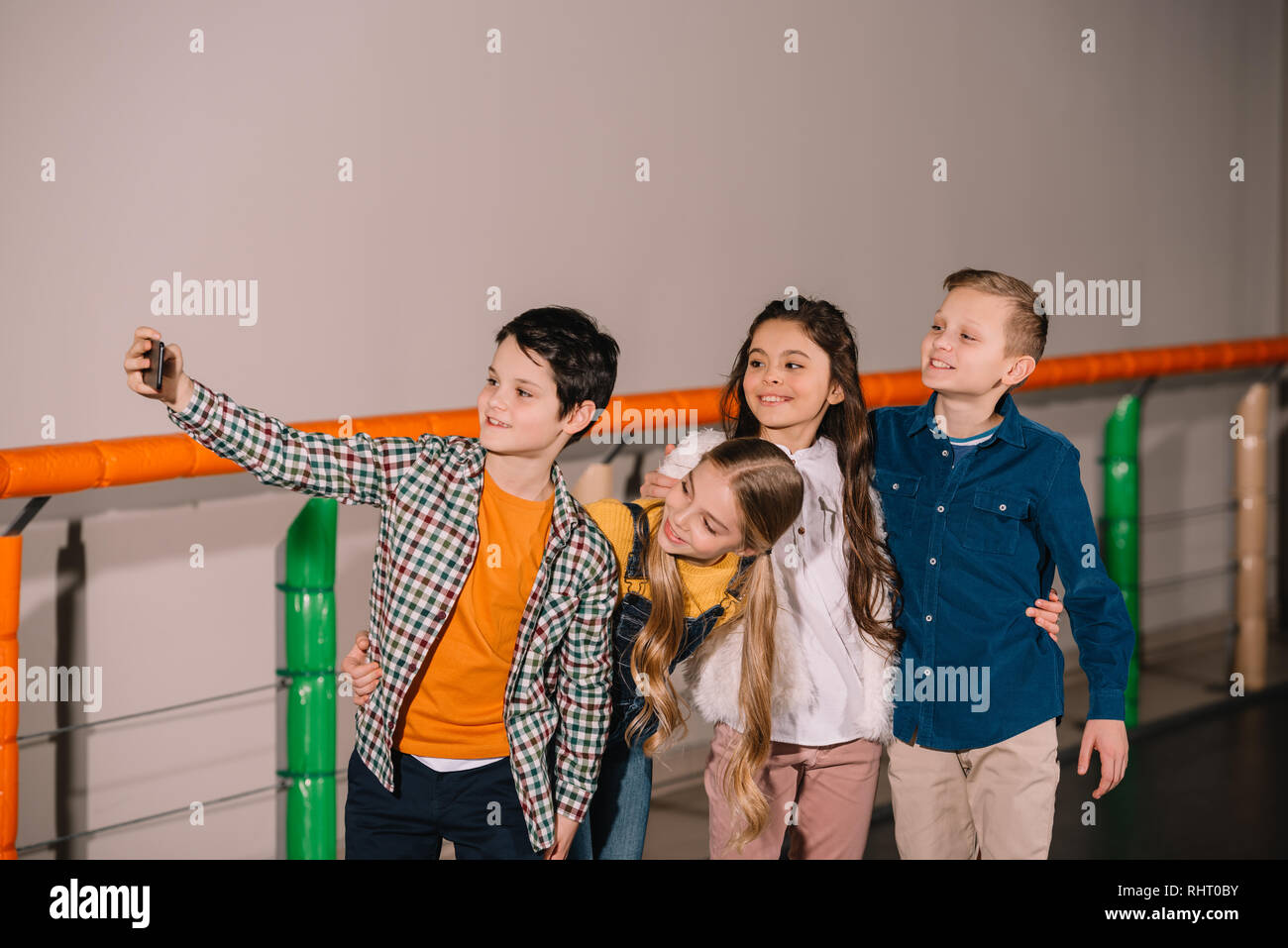 Excited children hugs and laughing while making selfie Stock Photo