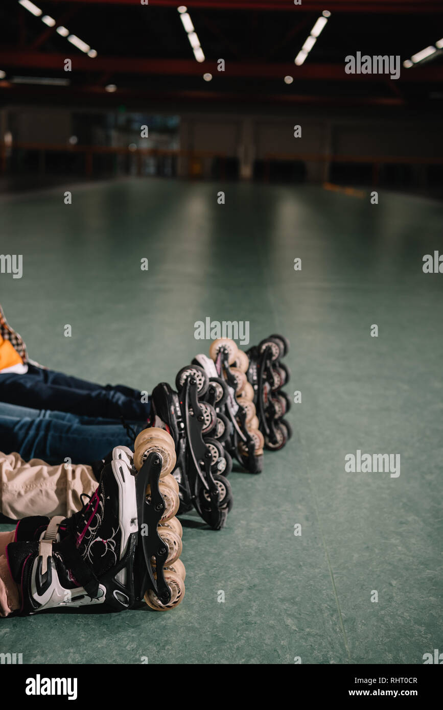Partial view of children in roller skates resting together Stock Photo