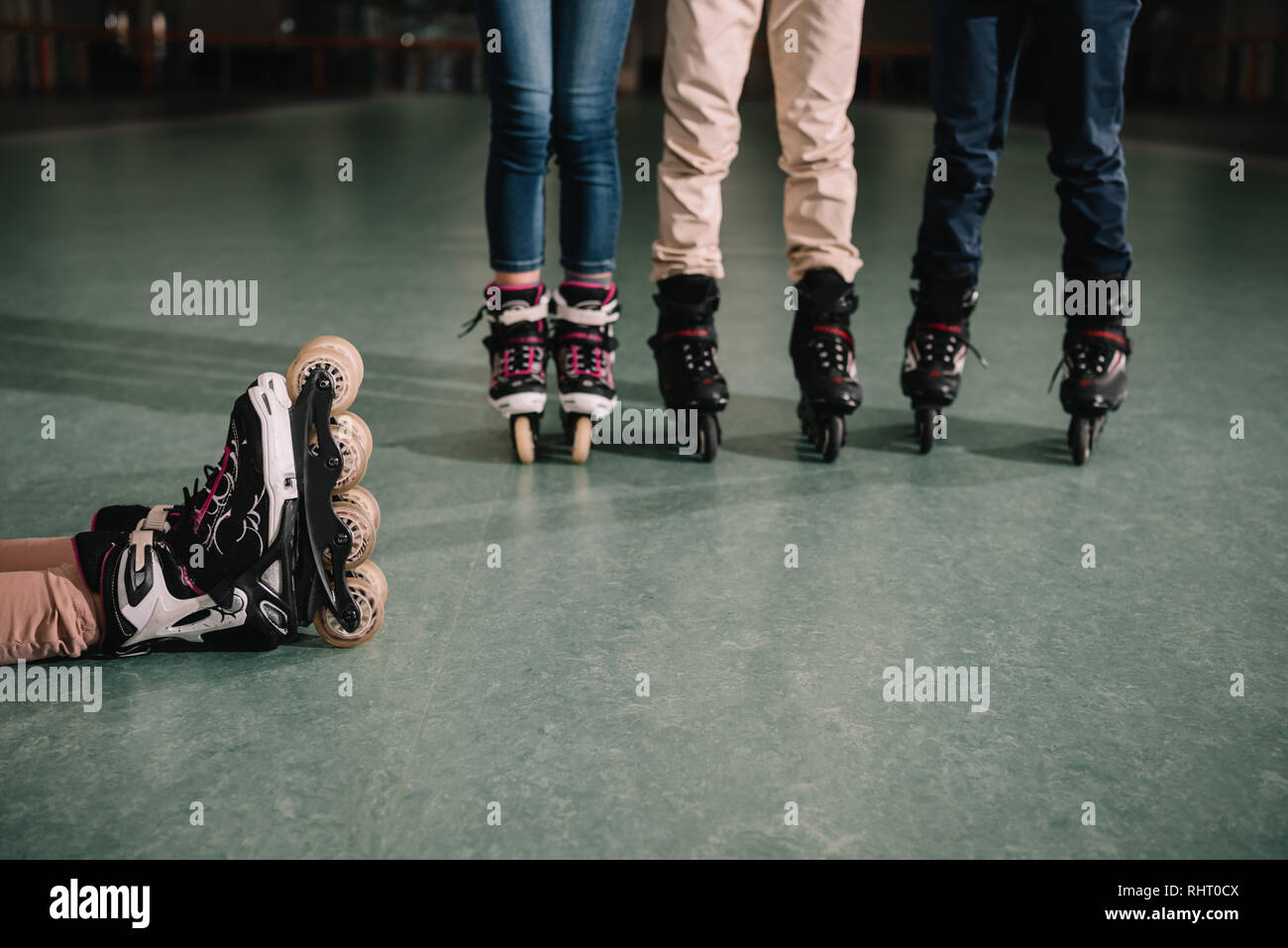 Partial view of friends in roller skates Stock Photo