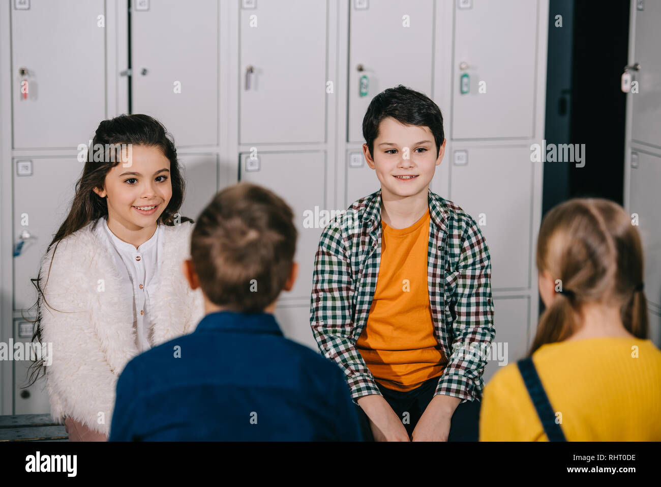 Group of children talking in changing room Stock Photo