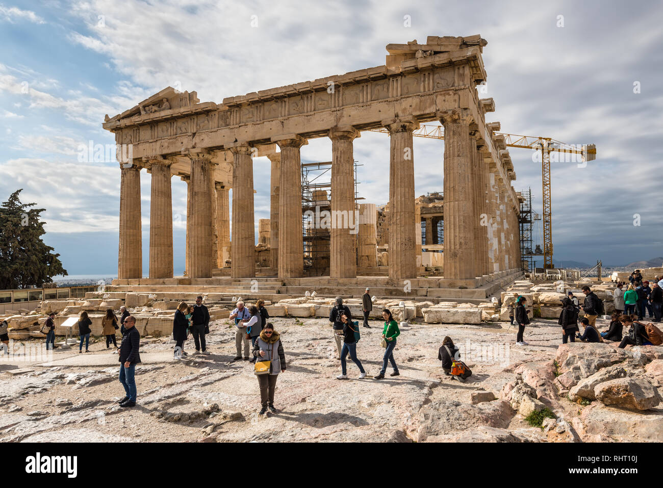 Athens, Greece - November 1, 2017: Many tourists visiting ancient temple Parthenon on Acropolis. Acropolis of Athens is an ancient citadel located on  Stock Photo