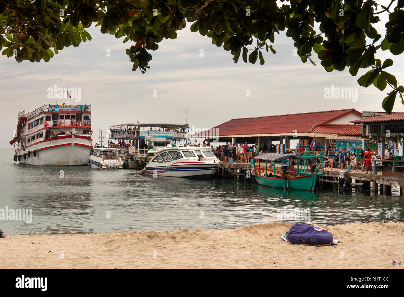 Cambodia, Preah Sihanoukh, Sihanoukhville, Occheuteal Beach, ferries moored at jetty for boats to offshore islands Stock Photo