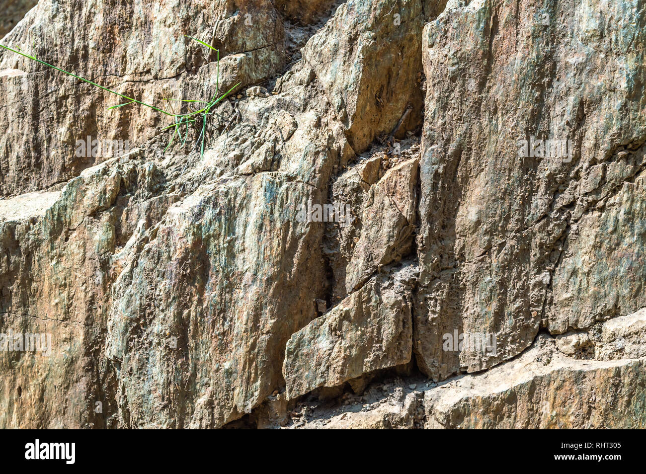 A rock wall mountain face with cracks and great details and texture Stock Photo