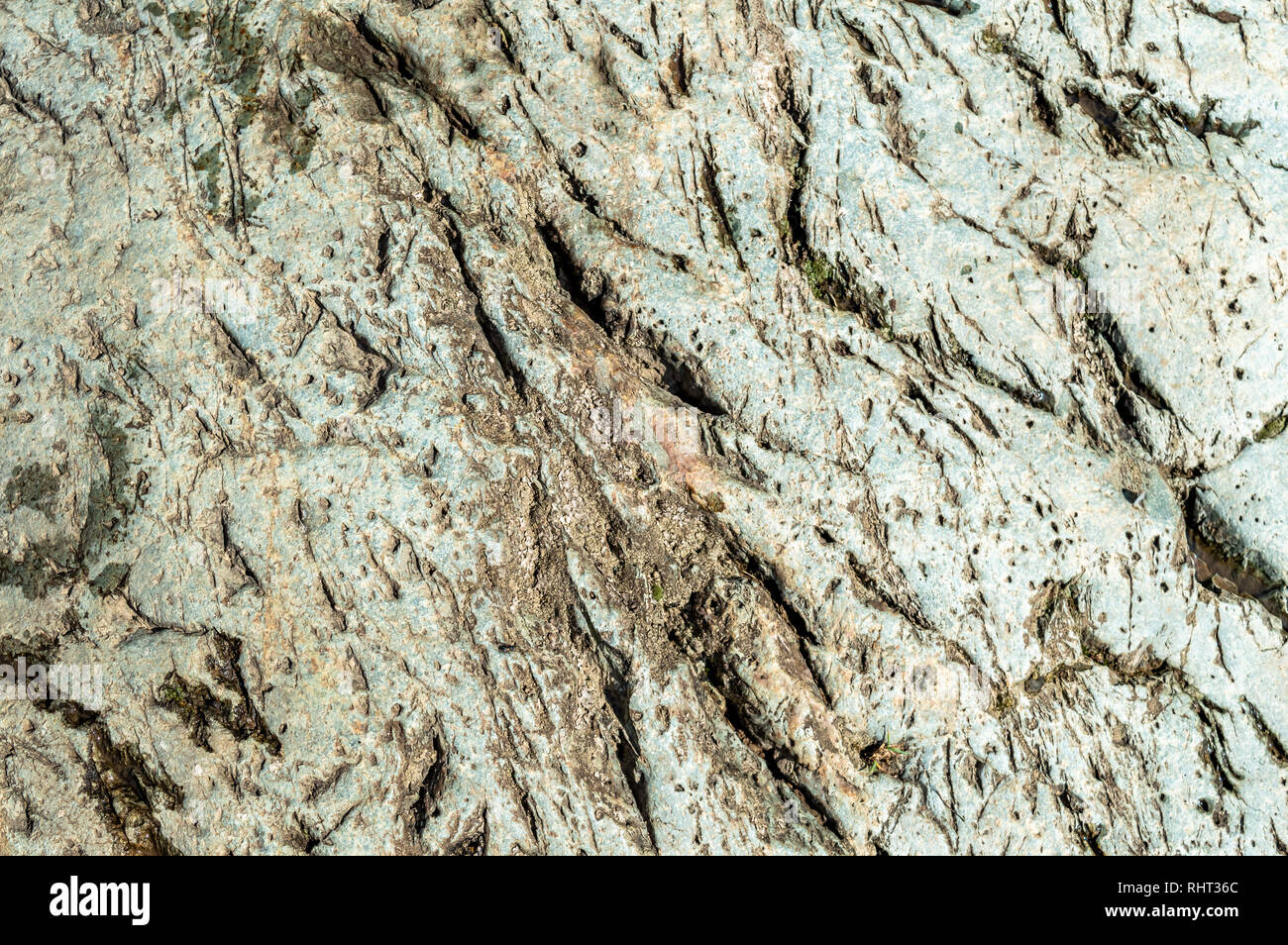 Texture and details on rock wall mountain face Stock Photo
