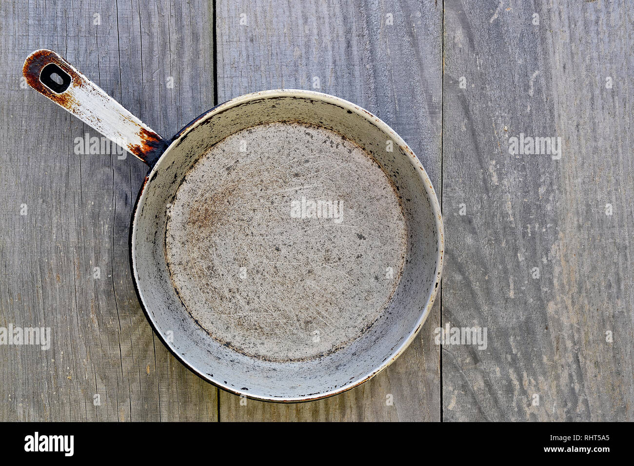 Cast iron antique frying pan on grey vintage rustic background Stock ...