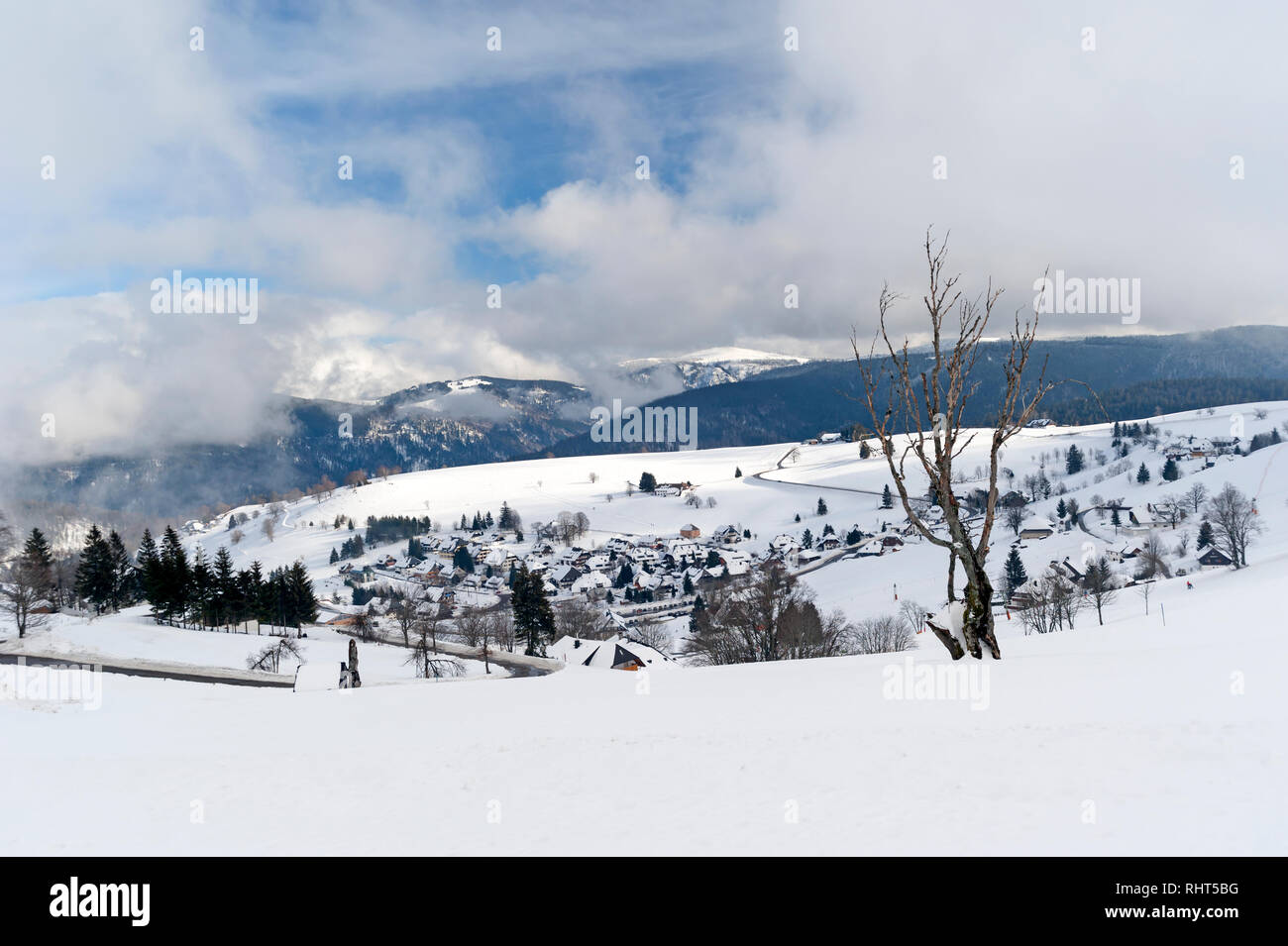 Hofsgrund in the Black Forest in the winter with Mt Feldberg in the background Stock Photo