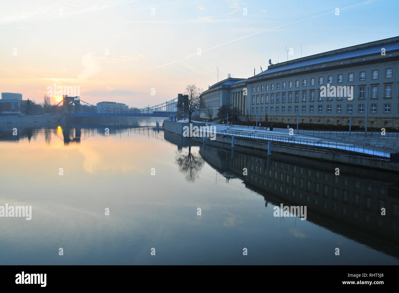 Provincial office, Government building of Lower Silesia on sunrise with calm Odra River reflection. Stock Photo