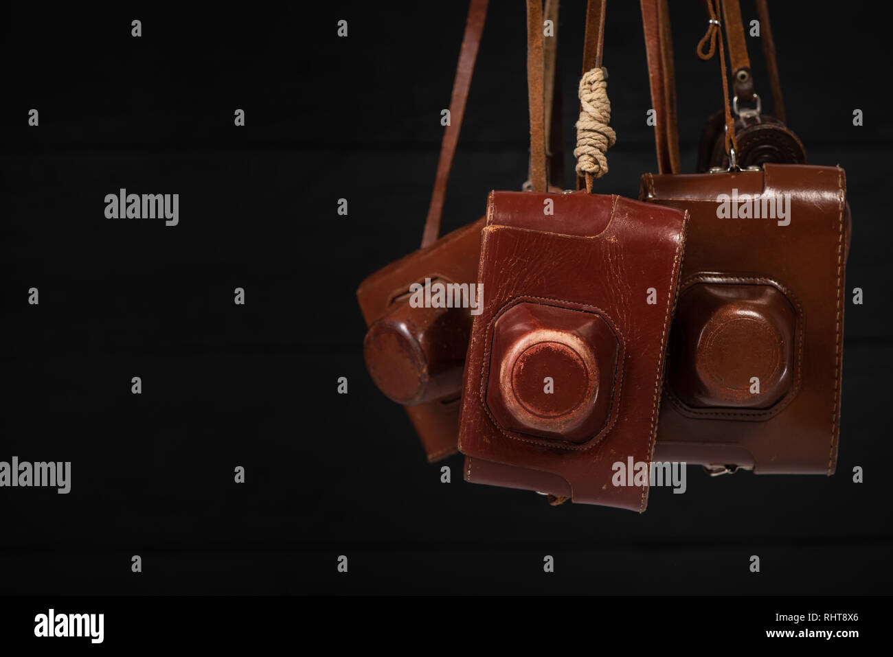 Group of retro cameras in covers. Collecting of antiques, auction theme