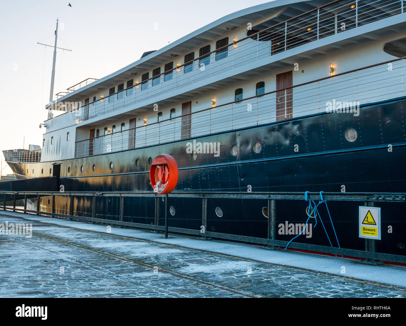 MV Fingal ship,  luxury floating hotel, in Winter with frost on quay, Leith, Edinburgh, Scotland, UK Stock Photo
