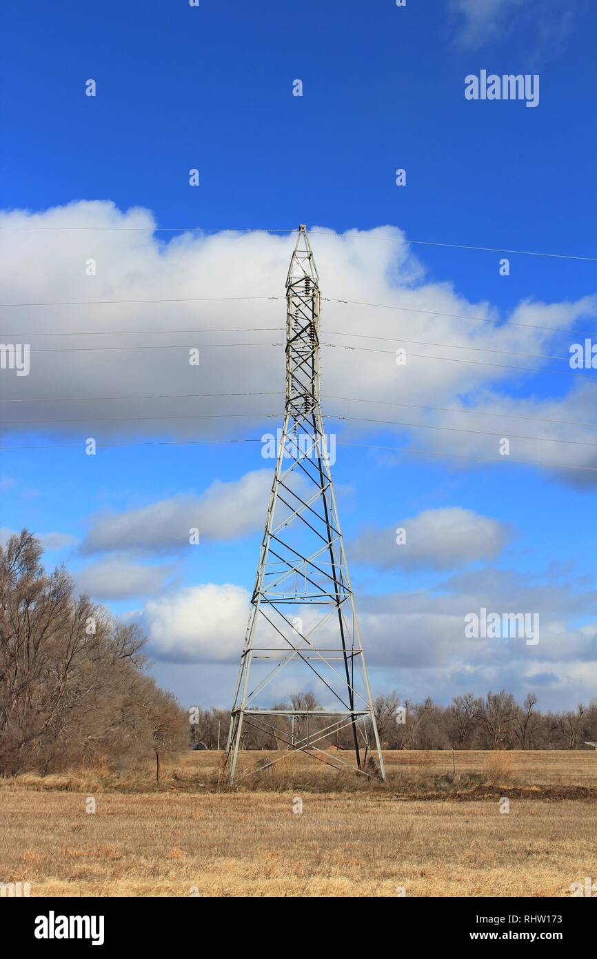 Power Tower with blue sky and white clouds Stock Photo - Alamy