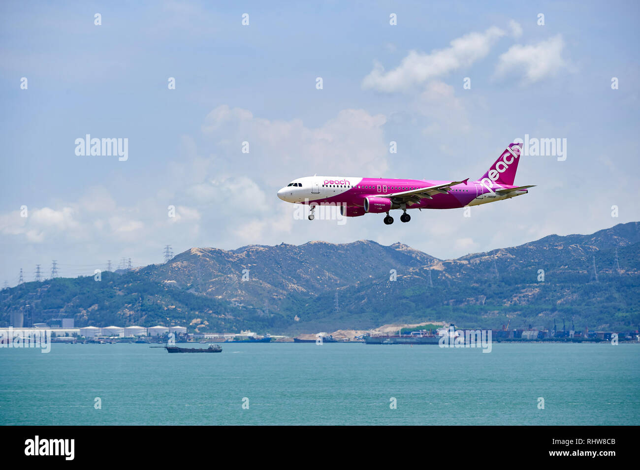 HONG KONG JUNE 04, 2015 Peach aircraft landing at Hong Kong airport