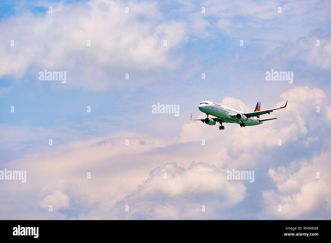 HONG KONG - JUNE 04, 2015: Philippine Airlines aircraft landing at Hong Kong airport. Philippine Airlines (PAL), a trade name of PAL Holdings, Inc. is Stock Photo