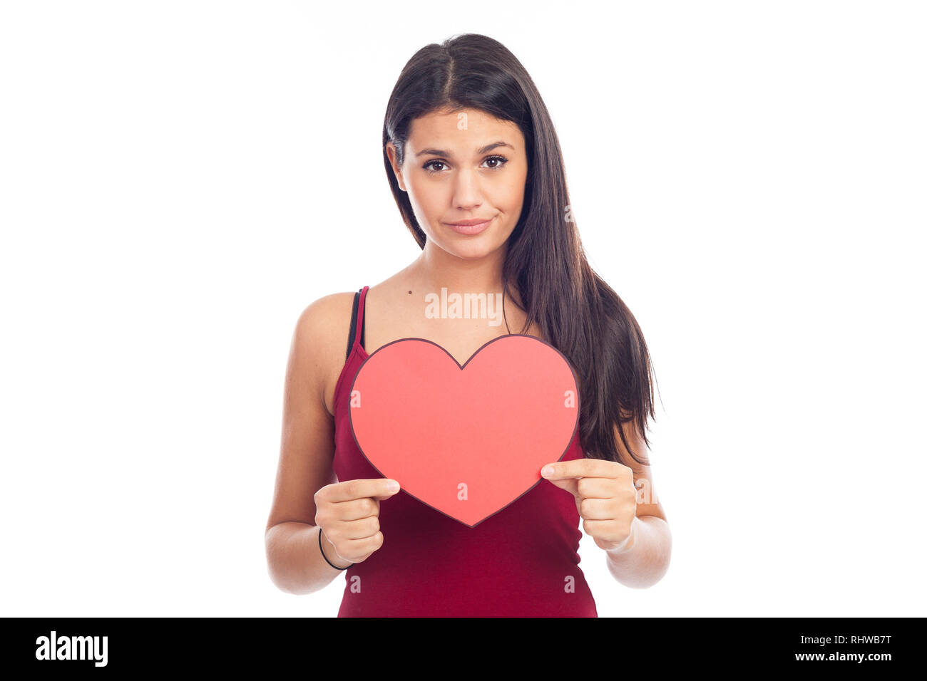 beautiful happy brunette woman holding and showing a big red heart ...