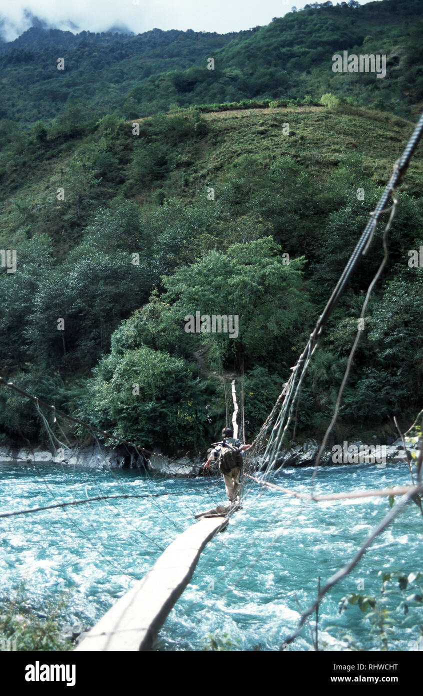 Rope bridge to cross mountain river hi-res stock photography and