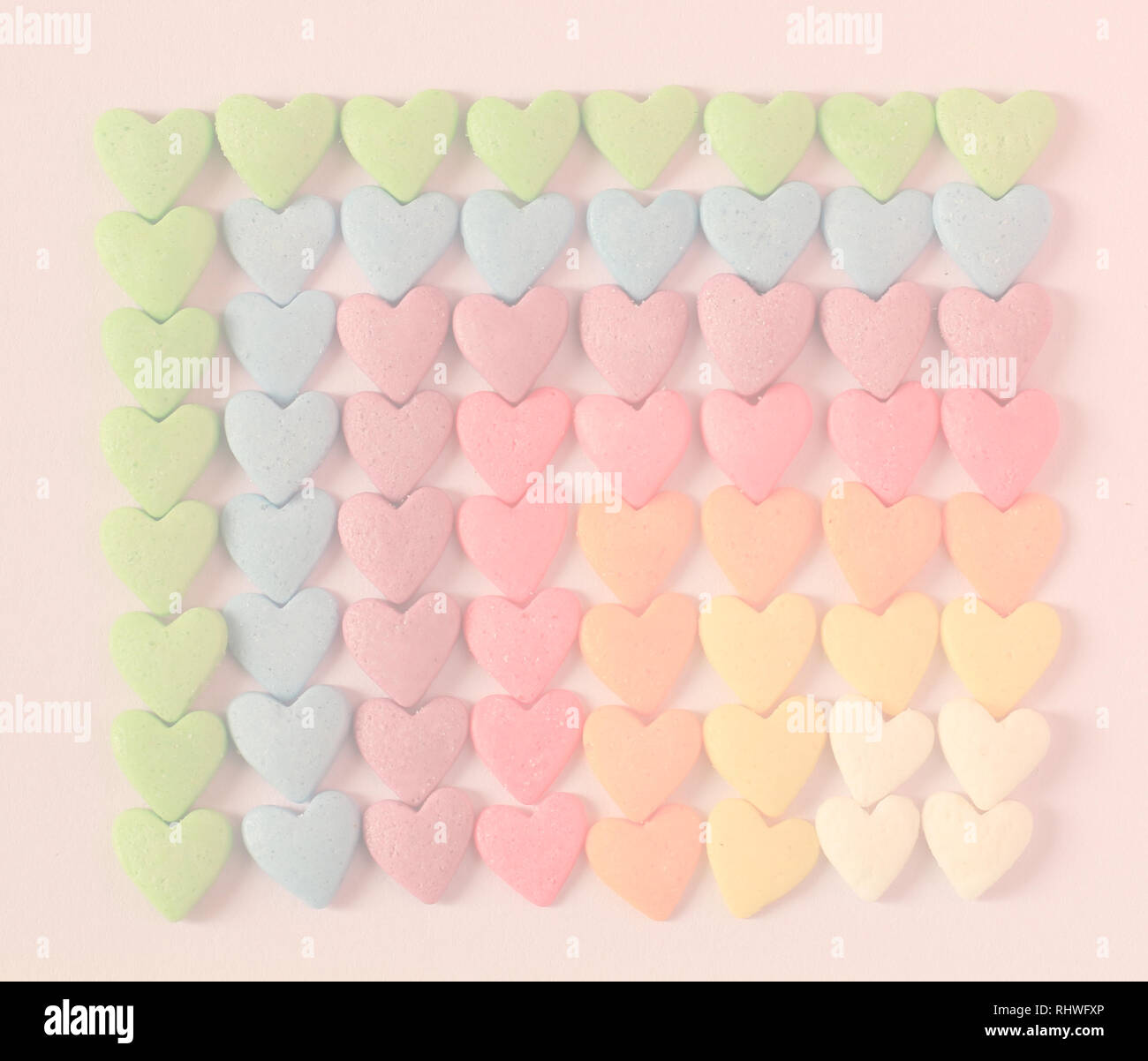 Colorful heart shaped candy pattern background Stock Photo - Alamy