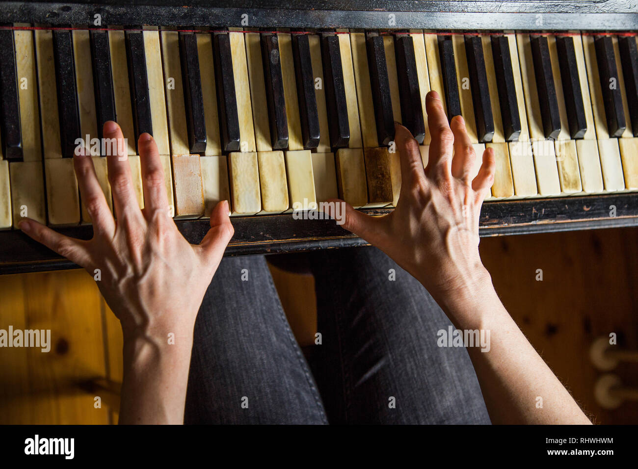 Close up fingers of woman pianist at the rusty piano keys, arms plays solo  of music. Hands of female musician playing. Music instrument, solo pian  Stock Photo - Alamy