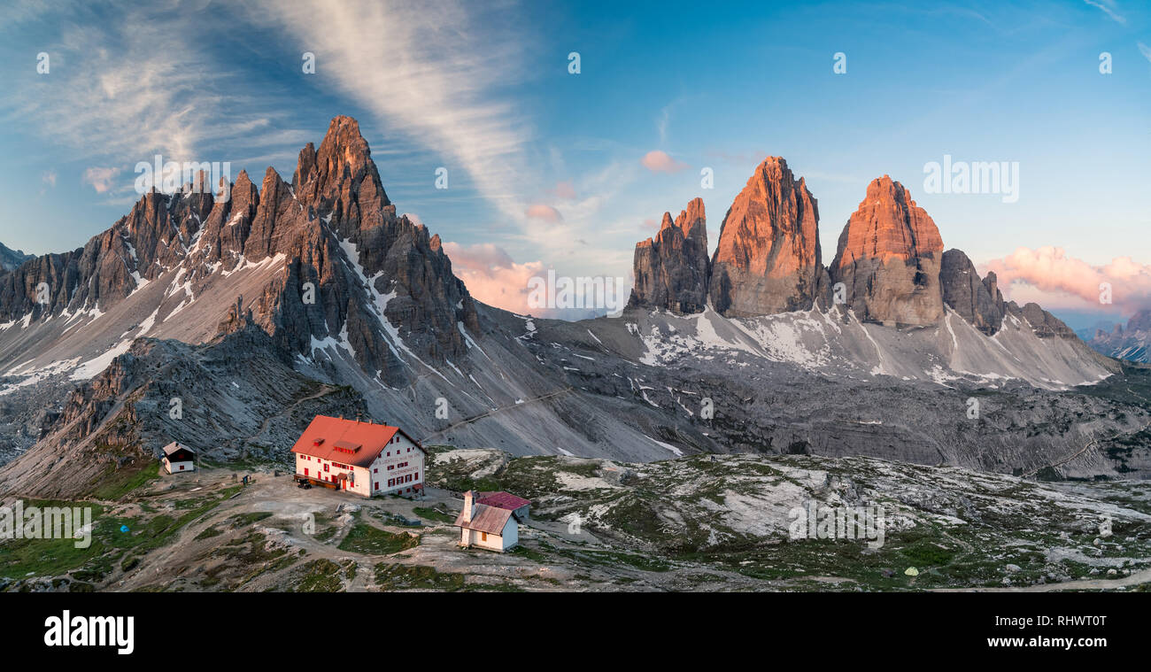 stitched panorama of Rifugio Lavaredo (Dreizinnenhütte) with Tre Cime at sunrise Stock Photo