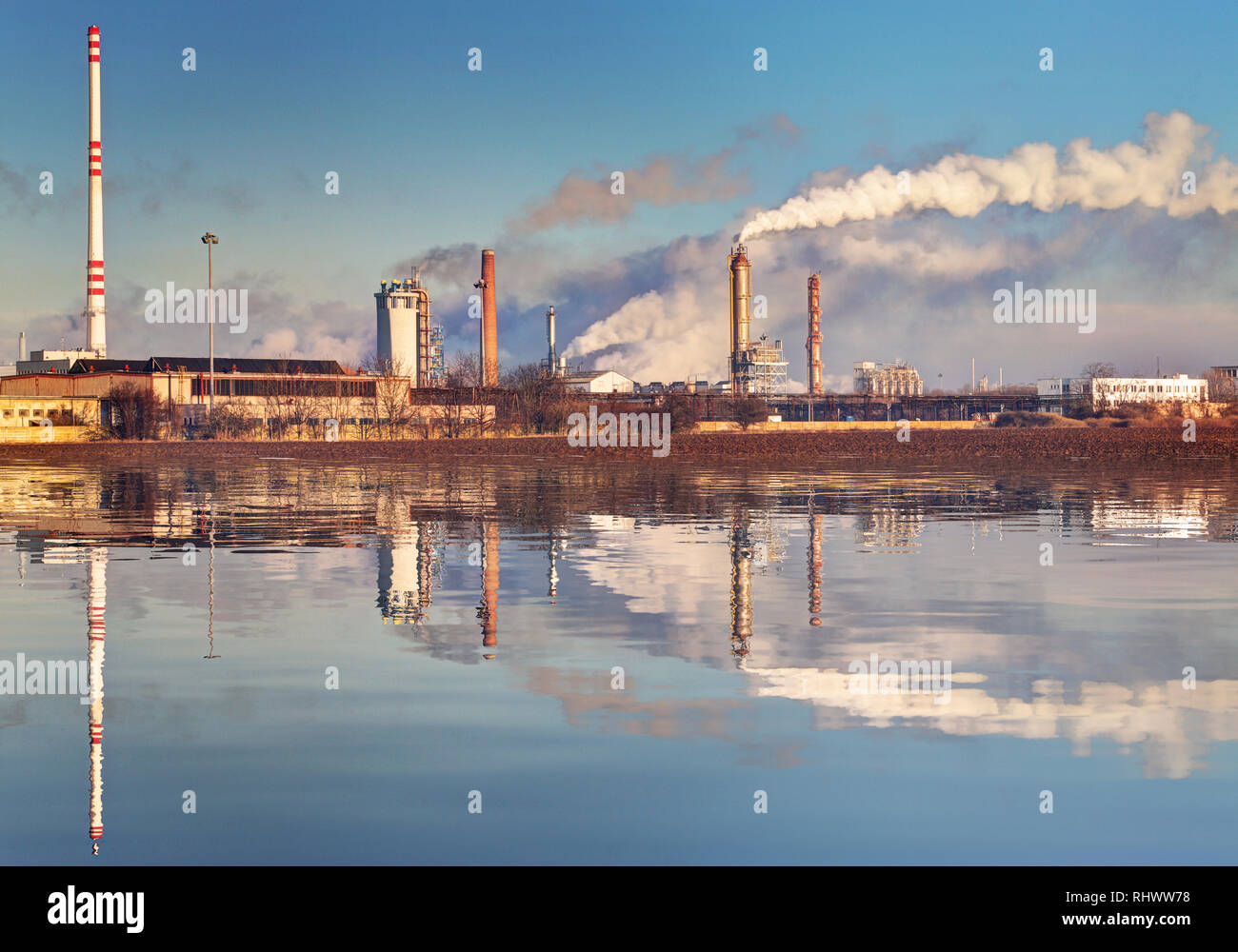 Air pollution coming from factory smoke stacks Stock Photo