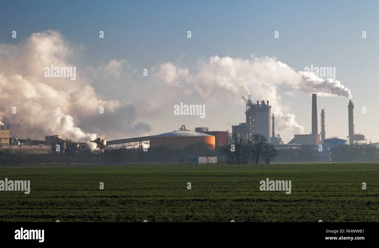 Air pollution coming from factory smoke stacks Stock Photo