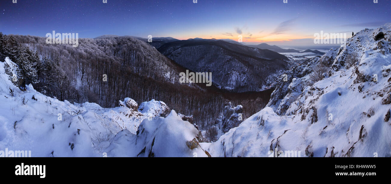 Panorama at night mountain with man Stock Photo