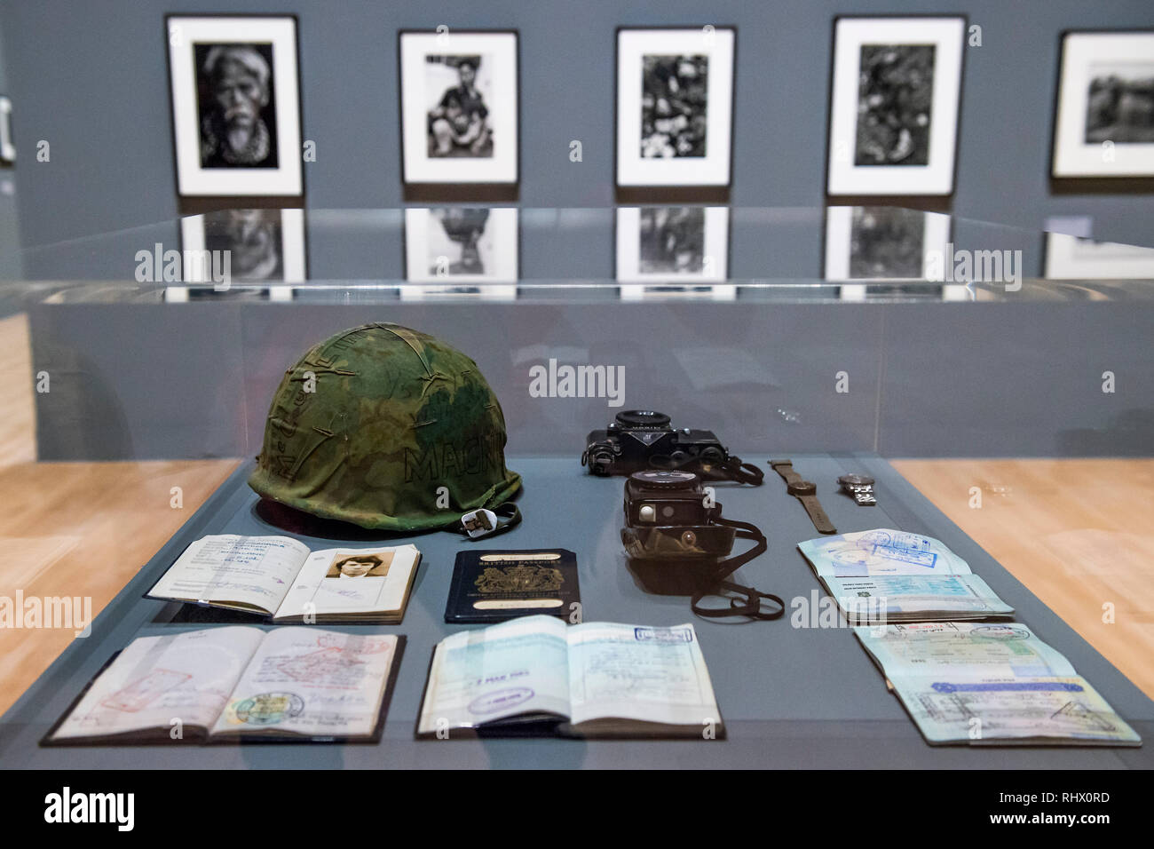 London, UK. 4th February, 2019. Passports, cameras and a Magnum helmet - A retrospective of the British photographer Sir Don McCullin at Tate Britain. With over 250 photographs, all printed by the artist himself in his own darkroom. Often taken at great personal risk, his conflict photographs are shown alongside his work in documentary photography, his travel assignments and his long term engagement with landscape and still life. The exhibition runs from 5 Feb to 6 May 2019. Credit: Guy Bell/Alamy Live News Stock Photo