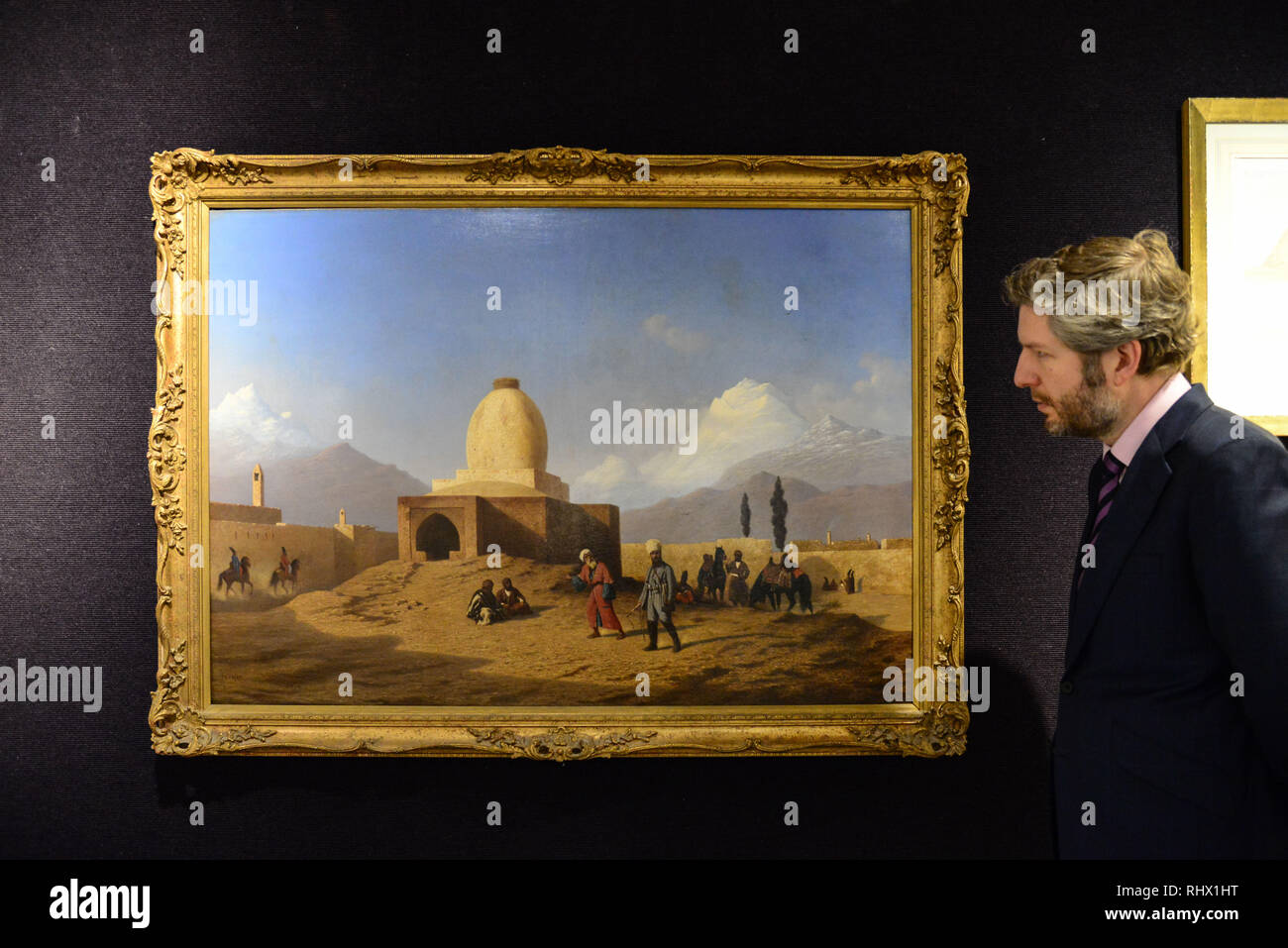 London,UK. 4th Feb 2019. Matthew Haley,  Head of Books, Maps and Manuscripts with Charles-Théodore Frère (French, 1814-1888) The Tomb of Esther and Mordechai, Hamadan, Iran, with the Alvand range of the Zagros Mountains in the distance. Estimate £ 20,000 - 30,000. Credit: Claire Doherty/Alamy Live News Stock Photo