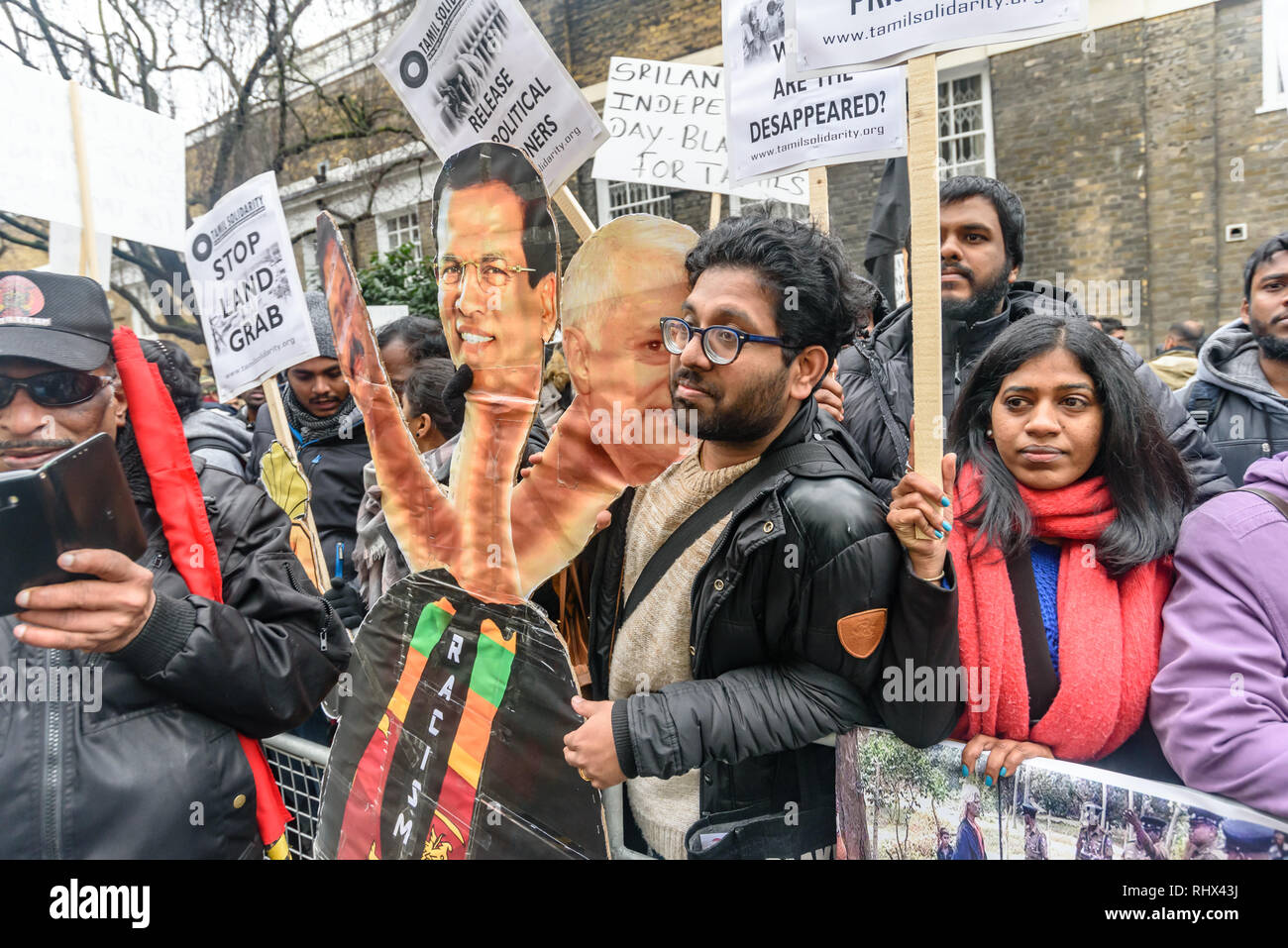 London, UK. 4th February 2019. Tamils protest with a three-headed racist monster of  Sri Lankan President Maithripala Sirisena, prime minster Mahinda Rajapaksa and another former PM outside the Sri Lanka High Commission, saying that his was a black day for Tamils in Sri Lanka. They demand the release of all political prisoners, an independent war crimes commission, information on the missing people and return of occupied land and call for the right to self-determination of the Tamil population. Peter Marshall/Alamy Live News Stock Photo