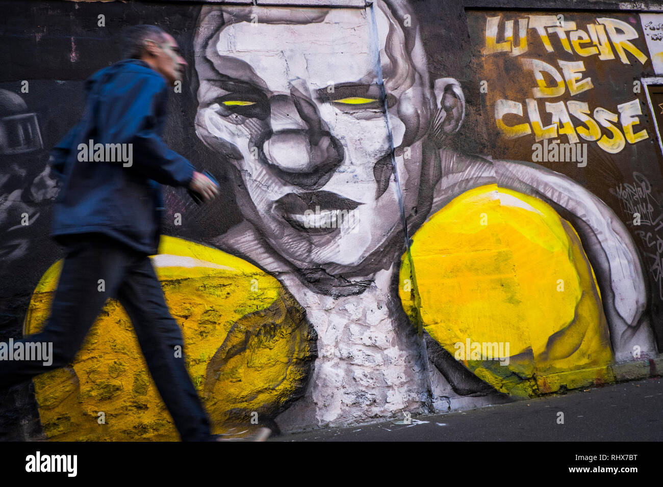 Grafitti representing a scene that happened during the Yellow Vests protest since the movement started on 17th November 2018. 20 artists from the Black Lines movement directed a 300 meter fresco on a wall of rue d'Aubervilliers in the 19th district (arrondissement) of Paris, on the theme of the Yellow Vests movement. Stock Photo