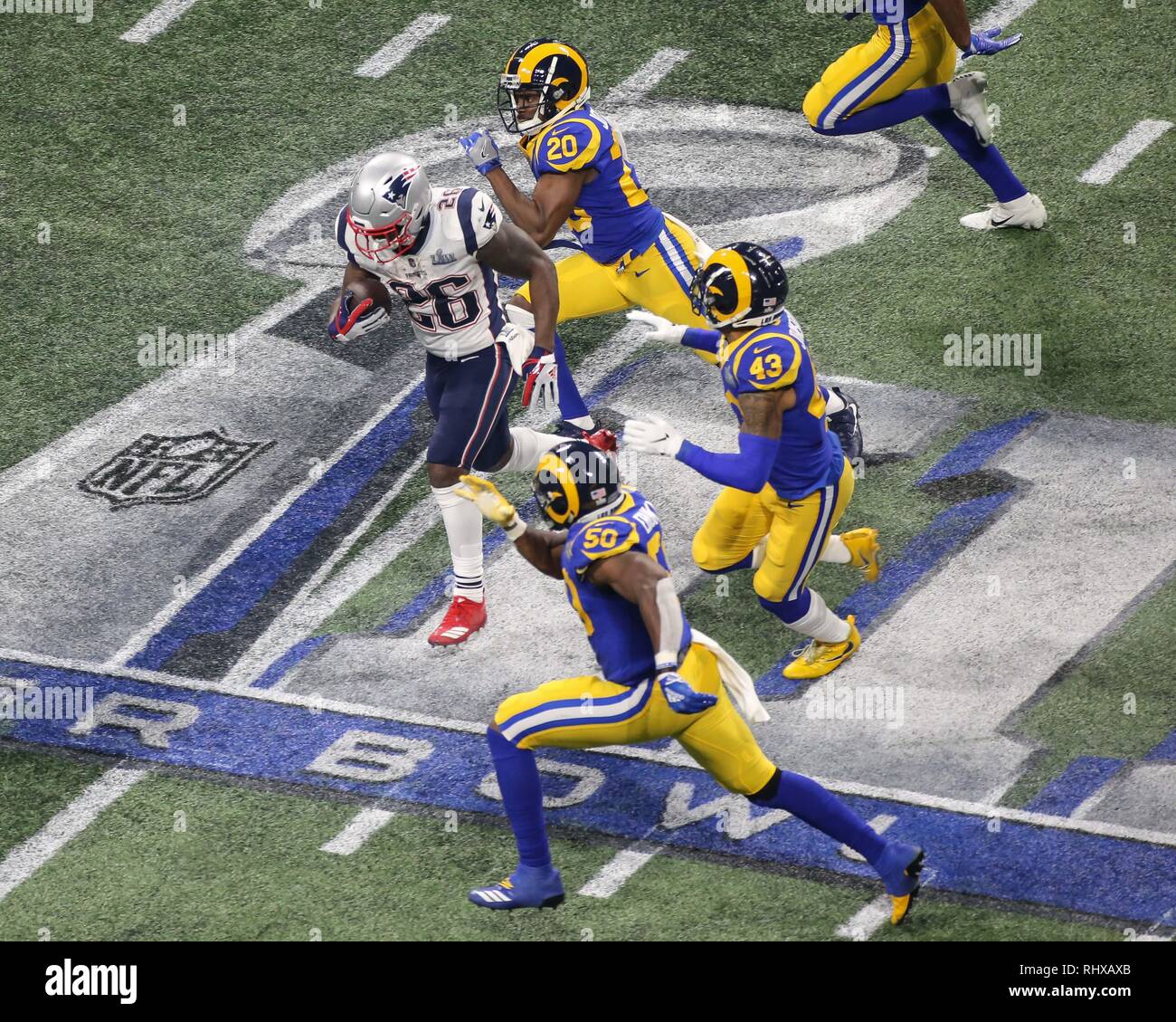 Atlanta, GA, USA. 3rd Feb, 2019. New England Patriots running back Sony Michel #26 running from Rams defense during the Super Bowl LIII between New England Patriots vs Los Angeles Rams at Mercedes-Benz Stadium in Atlanta, GA on February 3, 2019. (Photo by Jevone Moore) Credit: csm/Alamy Live News Stock Photo