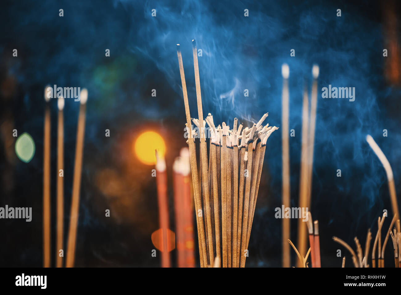 Incense sticks burning with smoke closeup view Stock Photo Alamy