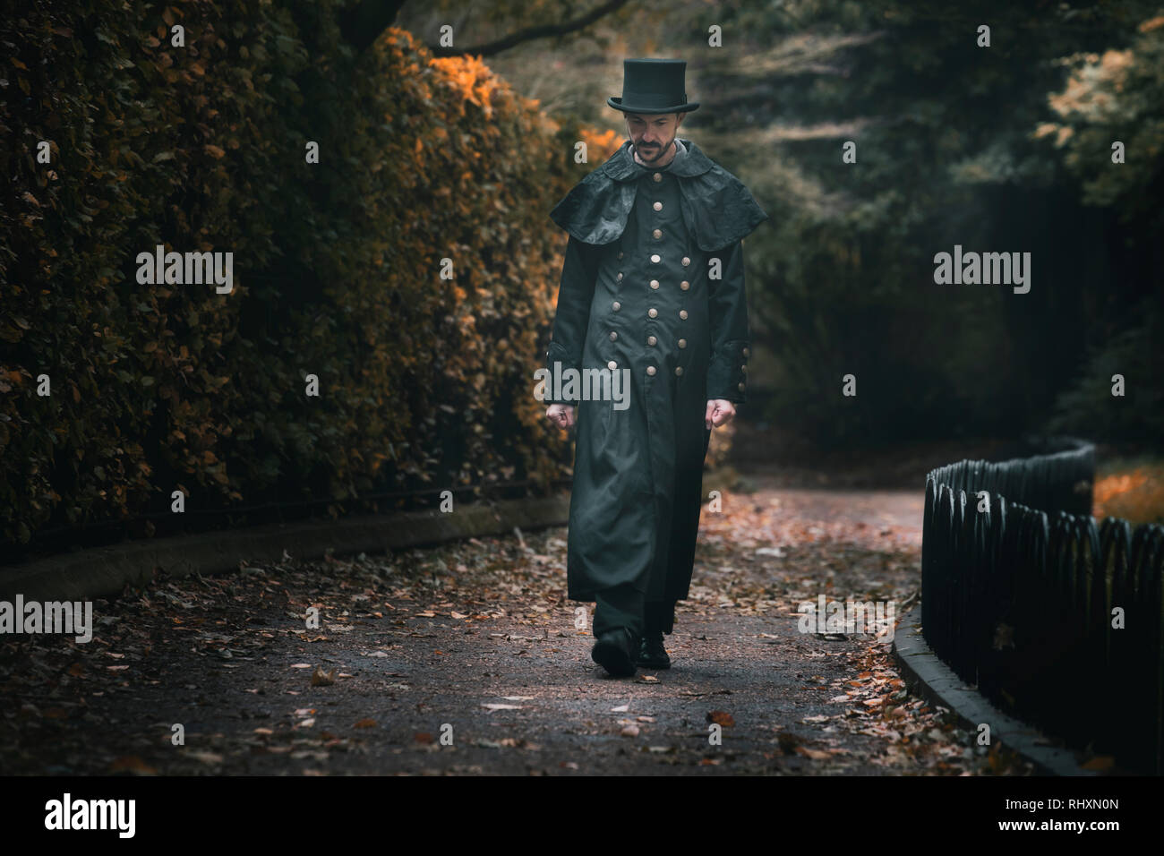 a Victorian man is walking along an alley in Oxford, England Stock Photo