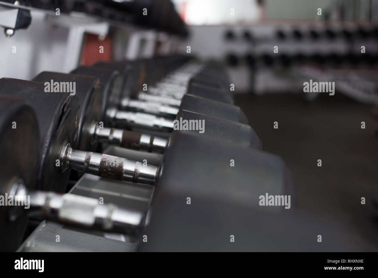 Dumbbell weights on rack for training equipment in gym Stock Photo - Alamy