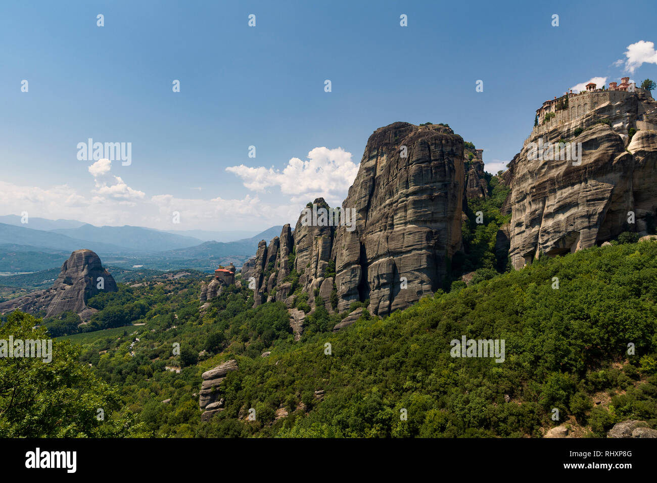 Meteora are rock formations hosting complexes of Orthodox Christian Monasteries,built on immense natural pillars & hill-like rounded boulders. Stock Photo