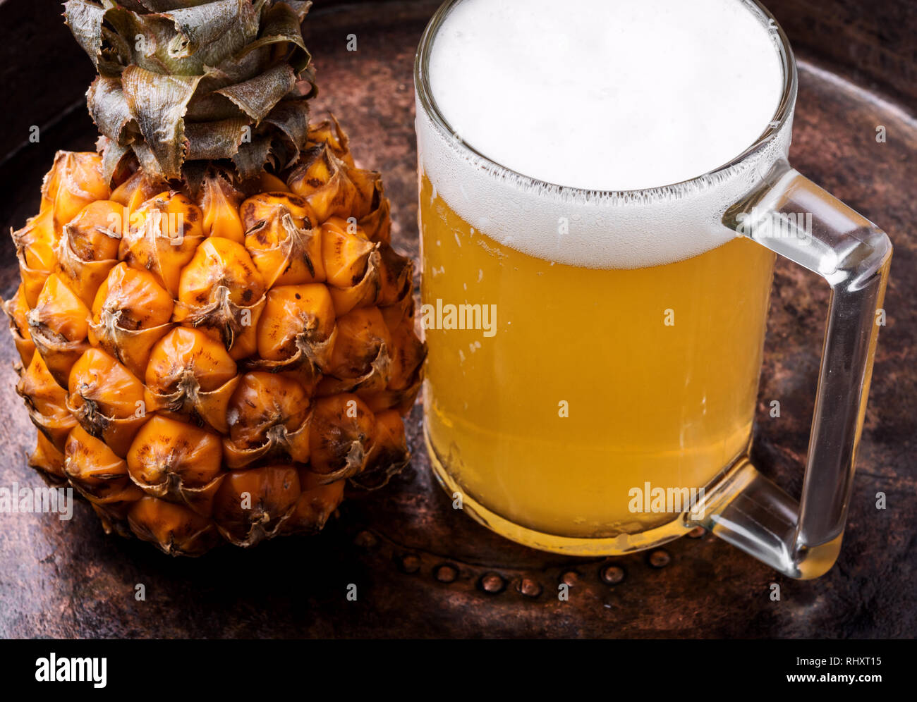 Glass with eya with pineapple flavor. Pineapple alcoholic ale Stock