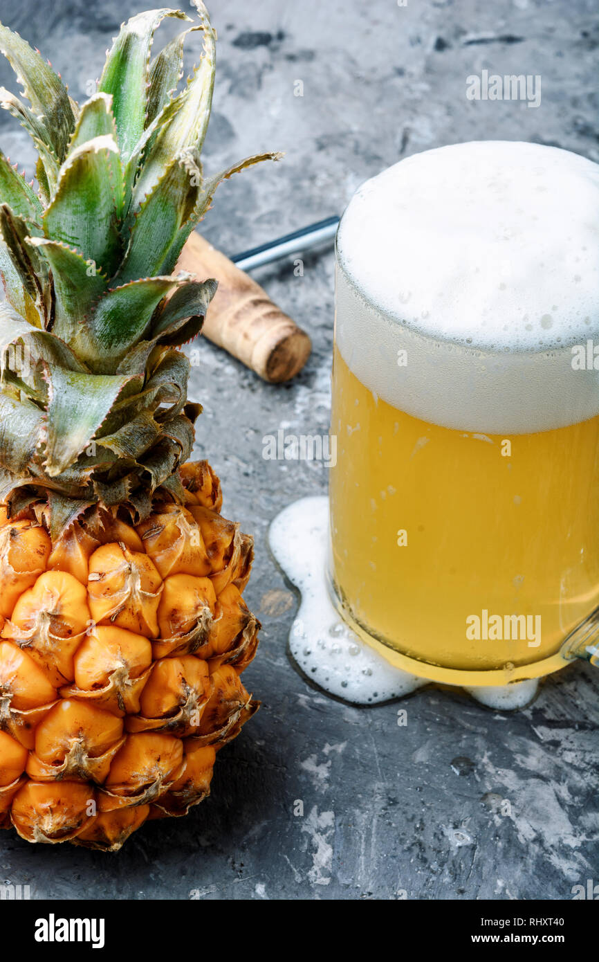 Glass with eya with pineapple flavor. Pineapple alcoholic ale Stock