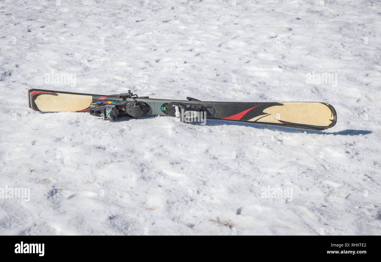 Ski kept on an icy snowy ground ready to be used Stock Photo Alamy