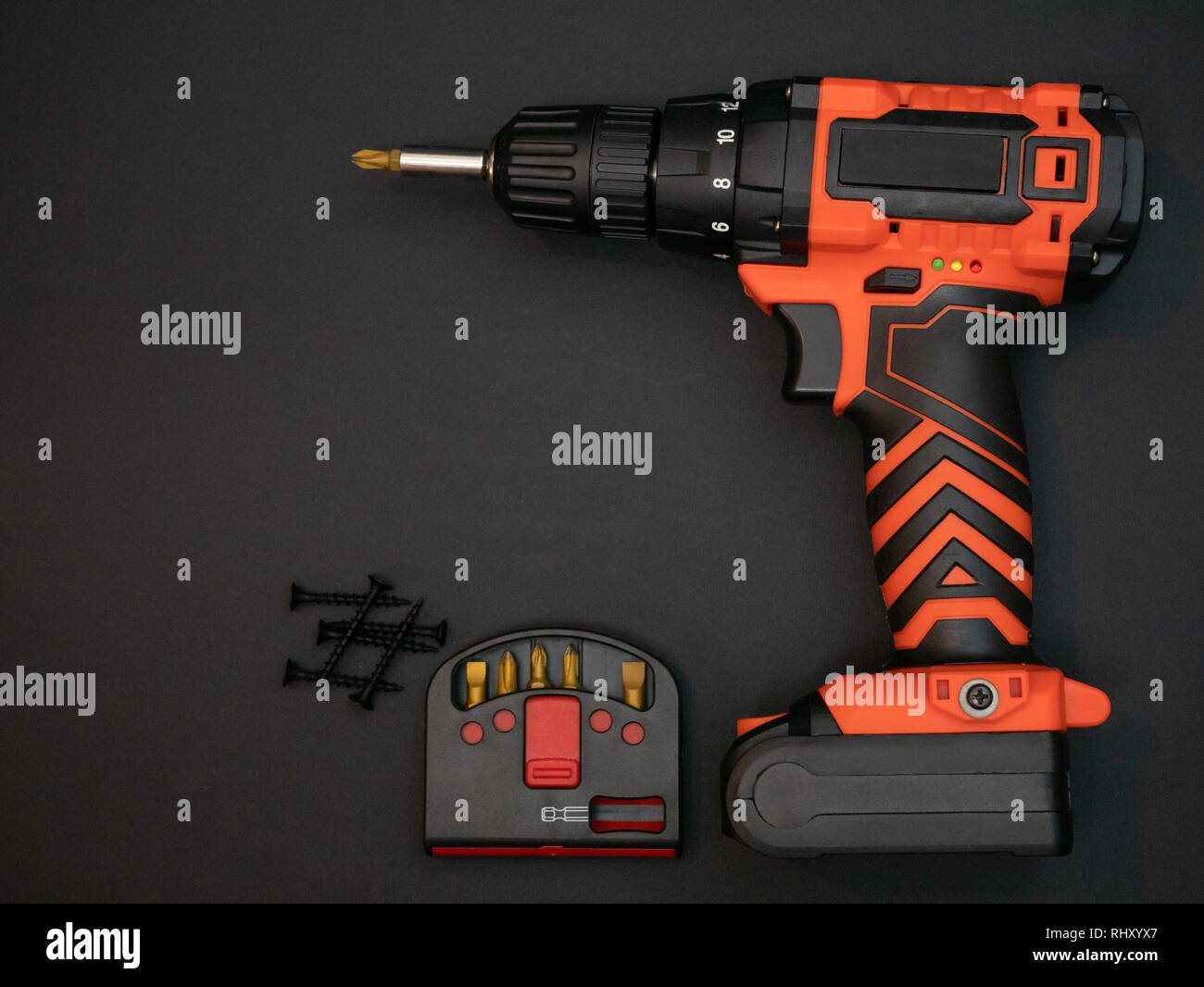 cordless crewdriver with set of drill bits and selftapping screws on