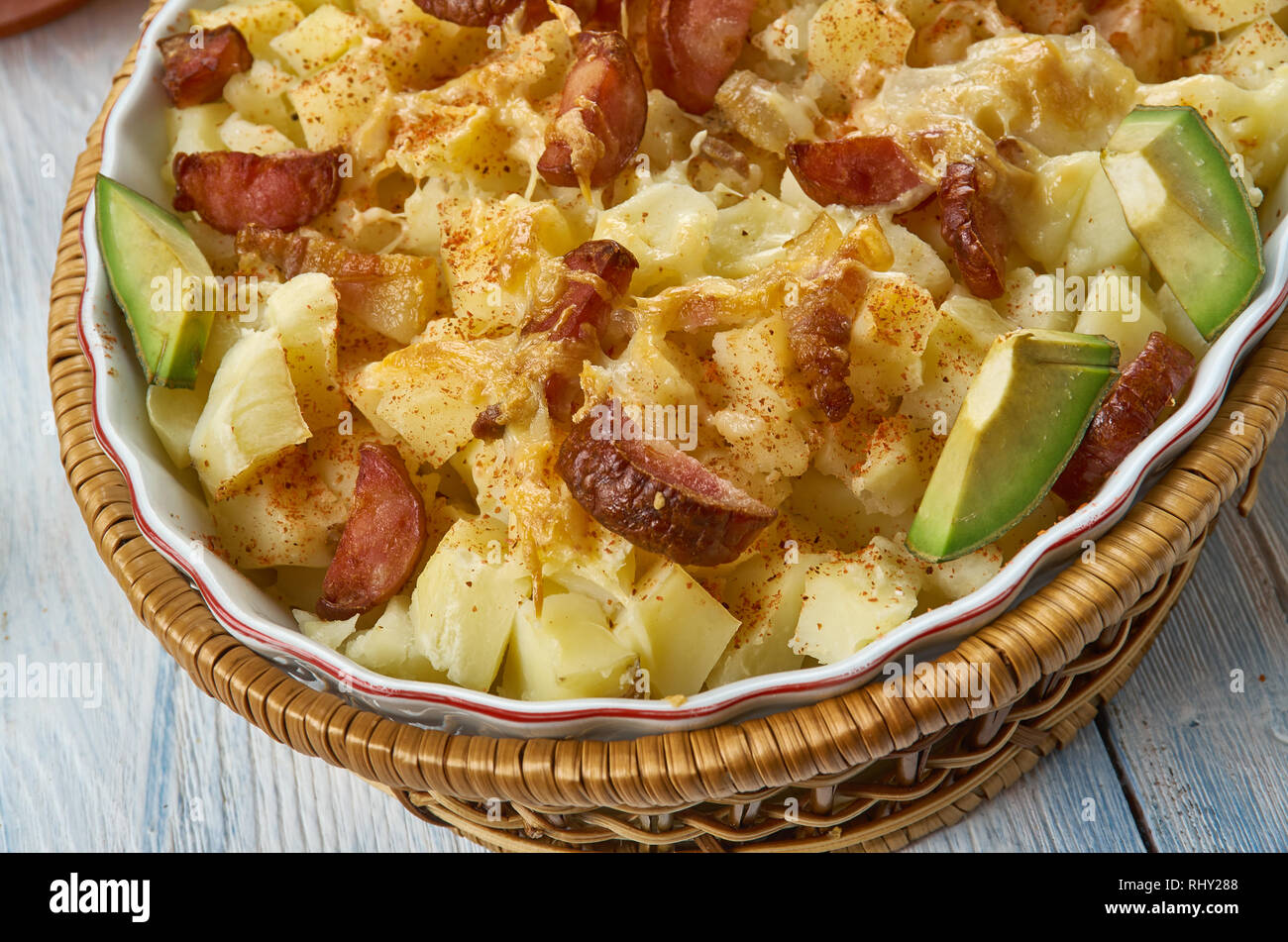 Ranch Potatoes, combine ranch dressing, taco seasoning, and half the shredded cheddar cheese