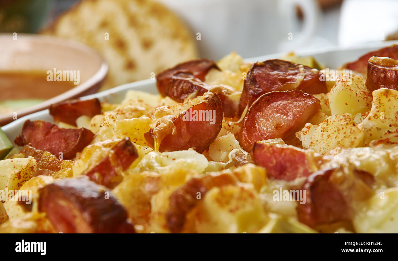 Ranch Potatoes, combine ranch dressing, taco seasoning, and half the shredded cheddar cheese