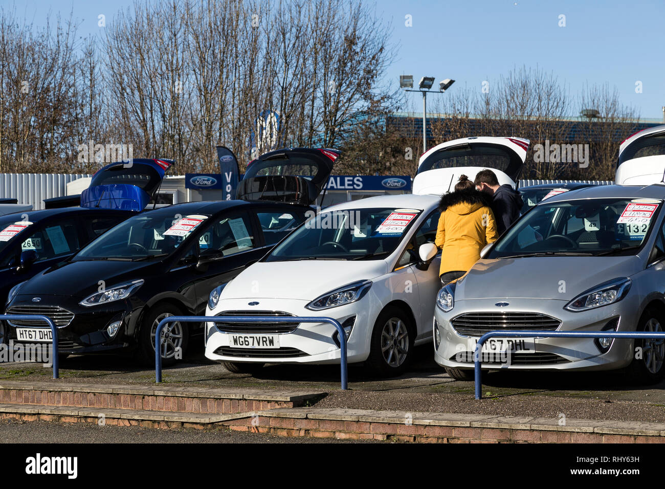 Car Dealership, Car, Car Salesperson, Buying, Shopping, New, Salesman, Customer, Retail, Happiness, Men, Occupation, Couple at Vospers Exeter Stock Photo