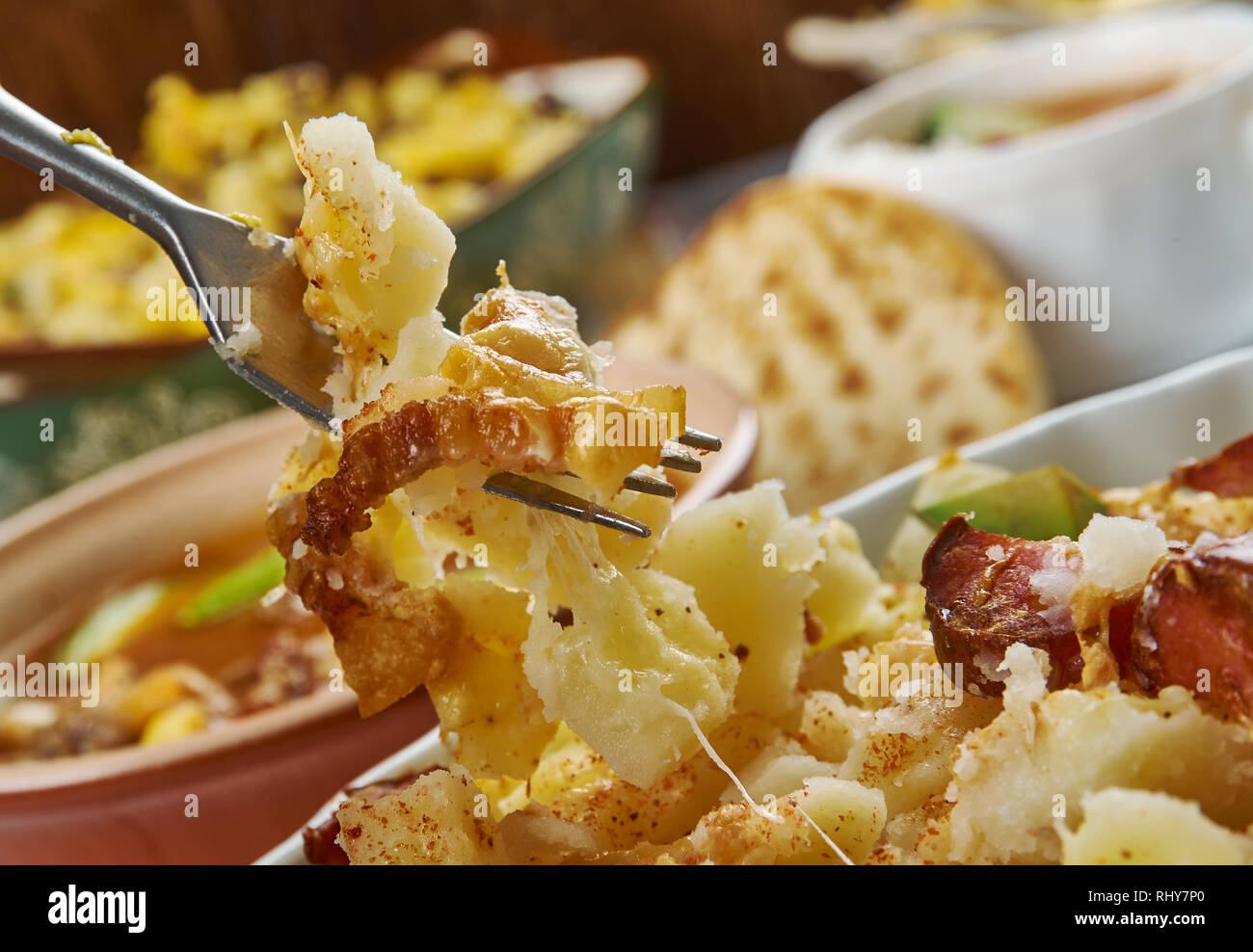 Ranch Potatoes, combine ranch dressing, taco seasoning, and half the shredded cheddar cheese